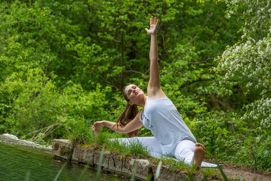 Girl in white doing yoga