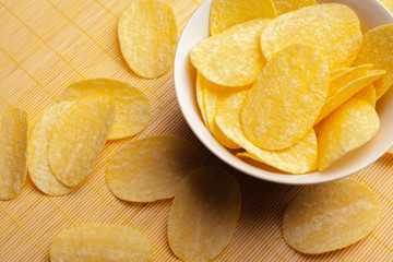 Potato chips in bowl on a table