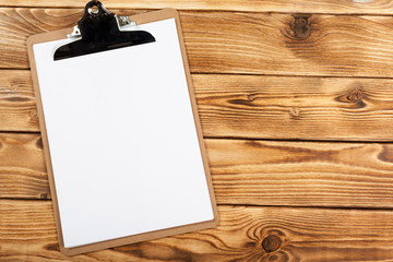 clipboard on wood background