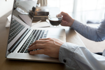  young man in cafe drinking coffee