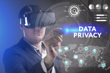 Business, Technology, Internet and network concept. Young businessman working in virtual reality glasses sees the inscription: Data privacy
