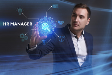 Business, Technology, Internet and network concept. Young businessman working on a virtual screen of the future and sees the inscription: HR manager