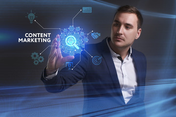 Business, Technology, Internet and network concept. Young businessman working on a virtual screen of the future and sees the inscription: Content marketing