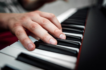 Fototapeta premium the pianist plays the piano. The pianist's hands closely. the view from the top .