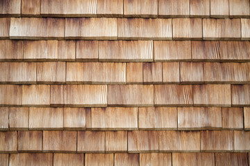 Traditional wooden shingles wall of an Austrian house.