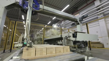 machine takes floorboard of the line