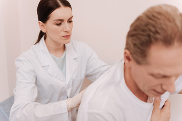 Dedicated young doctor focused on her task