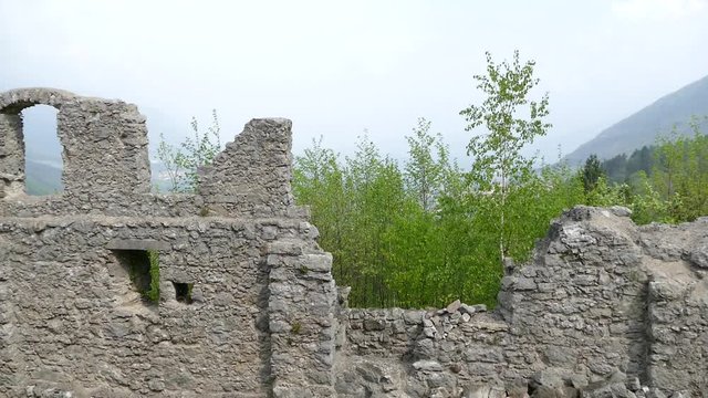
landscape around castle ruin castel belfort in italy