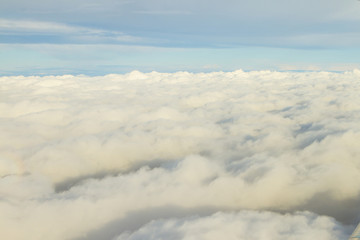 Aircraft window view, clouds
