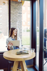 Naklejka premium Woman Using Tablet