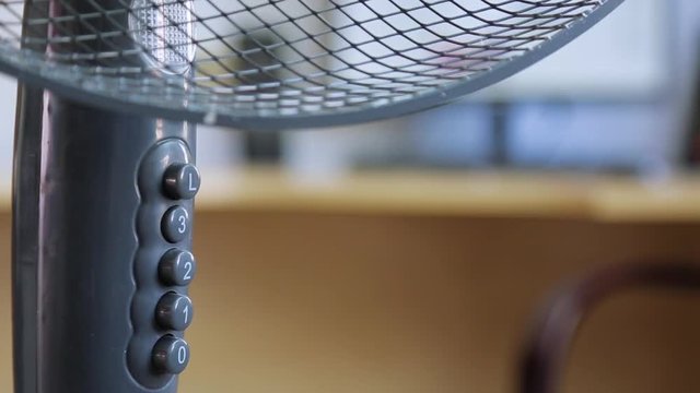 click the hand on the button of the air fan