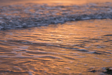 Waves reflecting the sun.