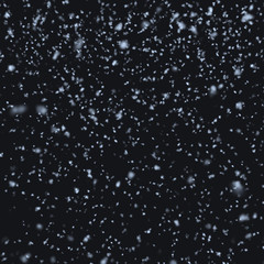 Snow falling at night
