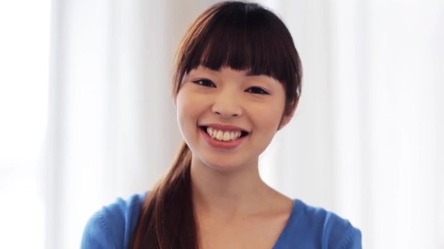 happy smiling asian young woman