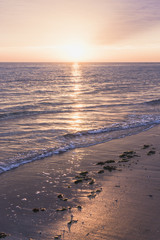 Shoreline at sunrise or sunset.