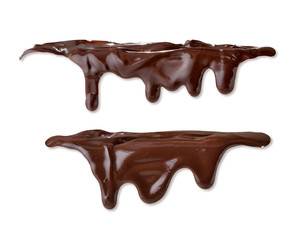 Melted chocolate streaming on white background close-up isolated 
