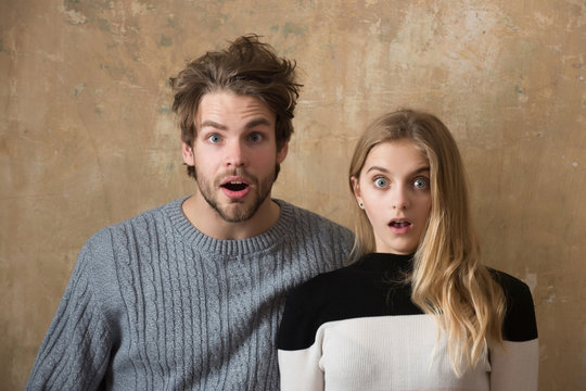 couple of friends or surprised man, woman with open mouth