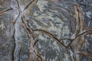 Cracks in the stone rocks from exposure to nature