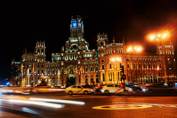 Fototapeta na wymiar Cybele Palace at the Plaza de Cibeles at night in Madrid, Spain