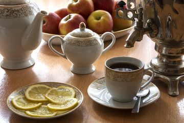 On the table is a tea set with a samovar