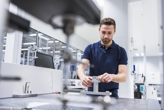 Man at a machine in testing instrument room