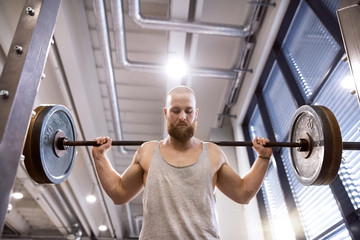 Young man exercising weight lifting