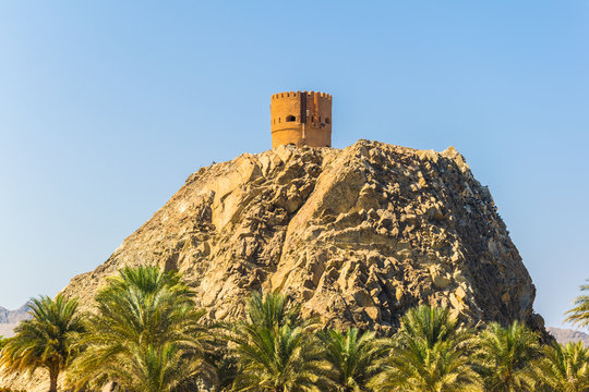 View of a watch tower behind the al riyam park in Muttrah district of Muscat, Oman.