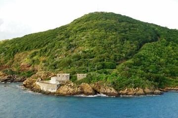 Fototapeta na wymiar Fort ruins on St Thomas island shore