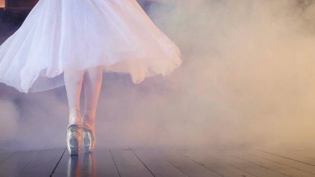Unrecognised ballerina turning around in the fog. Close-up. Dolly. HD.