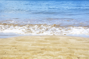 Sea foam on the shore of the beach