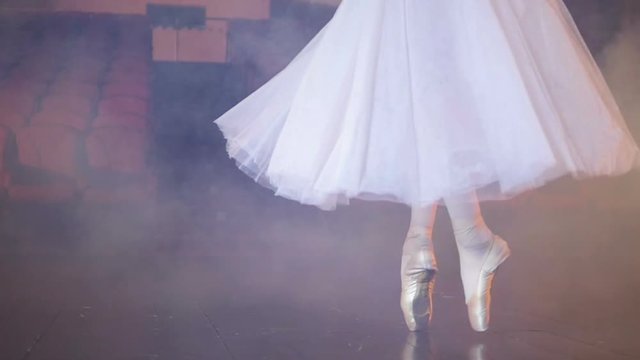 Dancing in the fog by unrecognised ballet dancer. Close-up. Dolly. HD.