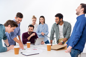 professional businesspeople discussing and brainstorming together on workplace in office, young professional group concept