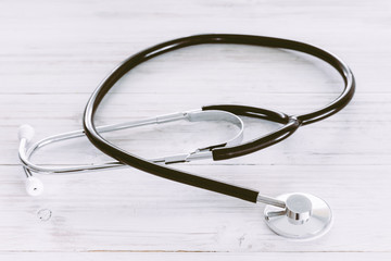 Stethoscope on wooden table