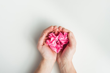top view of hands holding wrinkled papers isolated on white