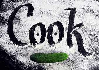 The inscription on the flour. Cook. Black background