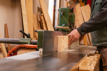 Craftsman working in his workspace. Joiner work in carpentry.