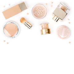 professional makeup cosmetics to even out skin tone: foundation, face powder and concealer isolated on white background with copy space for text. beauty, fashion, shopping concept. flat lay, top view