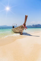 longtail boat in andaman sea with blue sky at krabi Thailand