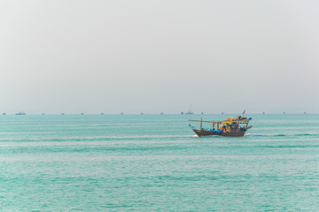 View of a dhow ship on an open sea in Kuwait.