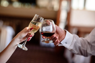 hand making toast with glass