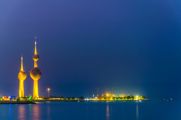 View of the illuminated Kuwait Towers - the best known landmark of Kuwait City - during night.