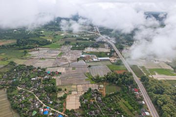 Aerial View of Village landscape and River over Clouds in Chiangdao Thailand
