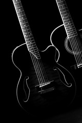 Fototapeta na wymiar Guitars in the dark.