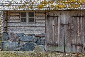 Facade of a very old wooden house in the countryside in Estonia