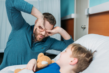 grimace dad and son having fun together in hospital chamber