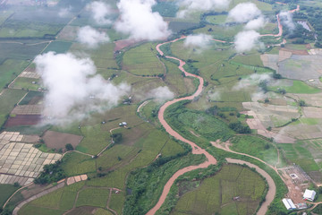 Aerial View of Village landscape and River over Clouds in Chiangdao Thailand
