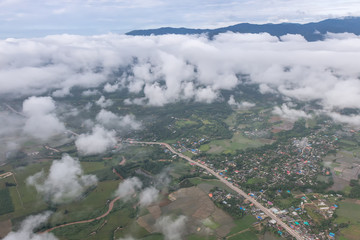 Aerial View of Village landscape and River over Clouds in Chiangdao Thailand
