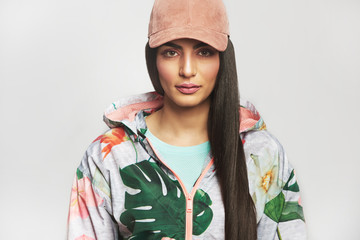 Woman in sports jacket and cap