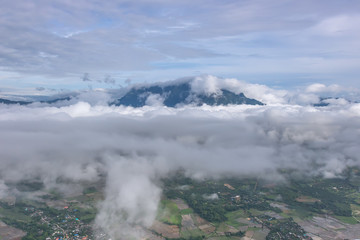 Aerial View of Village landscape and River over Clouds in Chiangdao Thailand
