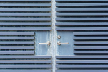 Light blue old steel door background and texture.